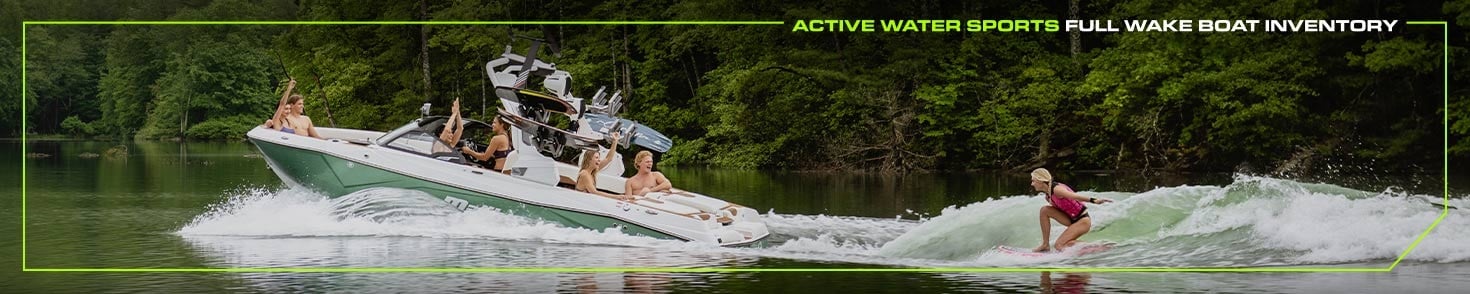 Banner Image with woman wakesurfing behind a Malibu Boat